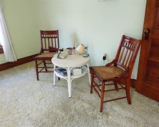 Wicker table with cane chairs.