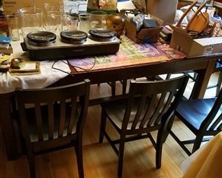 104" x 44" apx barnwood oak dining table, steel gear extension mechanism, 8 black slat back chairs