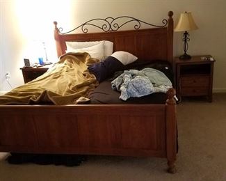 Pine and iron king bed head board, foot and rails with adjustable mattress.