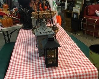 Collapsible picnic table and assorted lanterns.