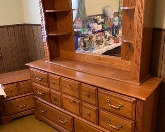 Dresser with lighted mirror, nightstand, and queen headboard (not shown)