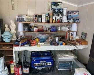 Lots of brand new items including Oneida cookware and utensils. Note the kerosene heater in the lower left-hand corner