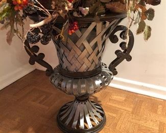 detail of autumn floral arrangement in metal urn