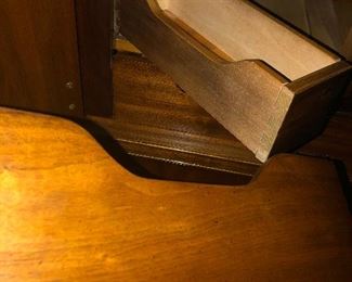 That is a hidden secret drawer within the drawer in this Asian Cabinet. Keep your treasures safe!!