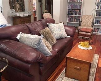 Gallery Furniture Leather Sofa, Pine Trunk Coffee Table, Area Rugs, Decorative Pillows 