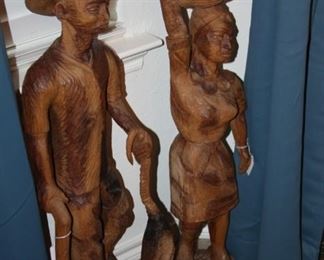 pair of large carved wood statues