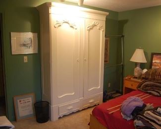 Armoire already painted and has shelving inside