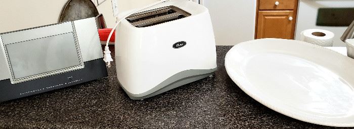 Clock/thermometer/calendar, Oster toaster & large platter.