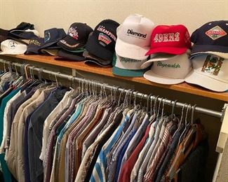 lots of men's clothes in two closets 