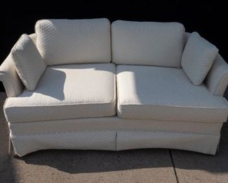 White upholstered love seat