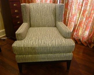 Gray arm chair with "silver" stiched design and silver stud details