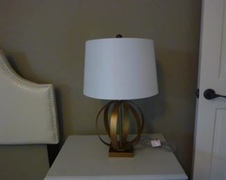 One of a pair of gold lamps