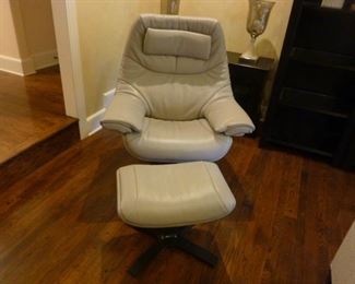 Contemporary Natuzzi leather "Revive" recliner with ottoman from House of Denmark