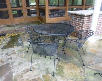 Wrought iron table and four chairs