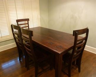 Great Dining table with four chairs and a bench. Really nice heavy, durable hard wood.