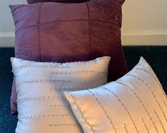 Item 61:  (2) Plum & (2) beaded decorative pillows:  $24                                                                                         Plum - 18" x 18"                                                                                                     Beaded - 12" x 12"