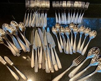Item 142:  Large set of silverware: $65
