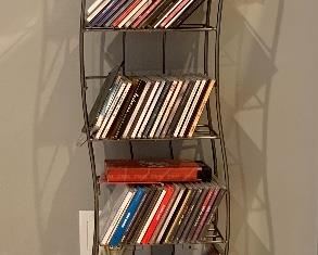 Item 148:  CD rack and CDs - 11"l x 6"w x 53.5"h:  $55