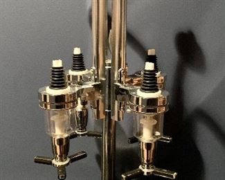 Item 102:  (4) Revolving bottle liquor dispenser:  $30