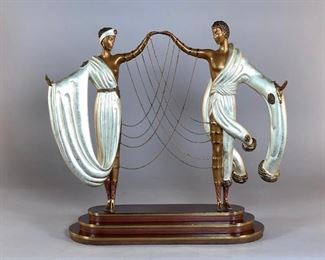 Erte (Romain de Tirtoff) (Russian/French 1892-1990) "The Wedding", Estimate $1,500 - $2,500. 1986, cold painted and parcel gilt bronze, signed Erte, with foundry mark for Fine Art Acquisitions, dated 1986, numbered 138/376.  Dimensions: 16 x 14 x 6 in. Weight: 24.5 lbs.  Condition: Lacking one chain, otherwise very good. BUYER'S PREMIUM 23%