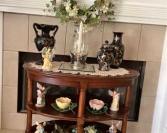 Beautiful walnut oval table with 2 shelves.