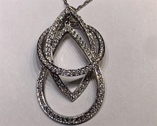 Swarovski necklace with circle,teardrop, and diamond shapes	
