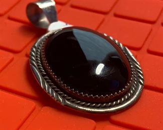 Sterling Silver Onyx Pendant	Measures 2 inches by 1 1/8 inch	

