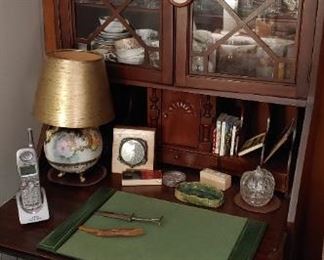 Small collectibles everywhere. Beautiful secretary