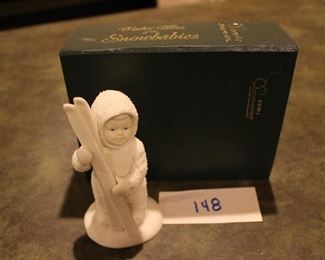 148 - Dept 56 Baby w/skis. Now $8.  Was $10