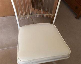 Two vintage chairs with Lucite backs.