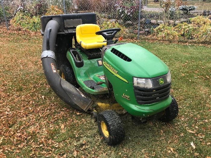 John Deere riding lawn mower with bagger attachment