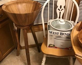 Crock pot, wooden standing salad bowl with serving pieces