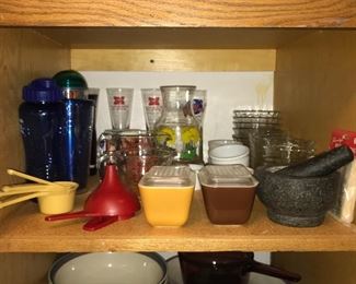 Pyrex refrigerator dishes, Pyrex measuring cups, Miller High Life beer glasses, mortar & pestle, juice jar