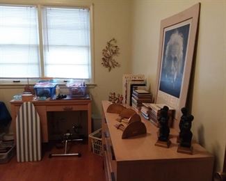 Exercise Peddler Machine; Table Top Ironing Board; Wall Decor; Books; Office Supplies; Small Wood Sewing Table with Matching Dresser/Cabinet (these were made by the homeowner & have a great Mid Century Modern look); vintage figurines; statuary; wall shelves (Better photos to come)