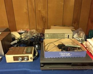 Assorted Vintage and Newer Electronics, including cassette records, DVDs, VHS Players, Remotes, Telephones, Cords Galore, Radios, Clocks