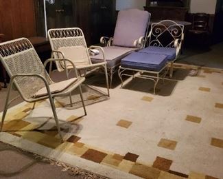 Vintage rug and wrought iron lounge chairs