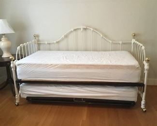 White Wrought Iron Day Bed with Trundle and Twin Mattresses. (80in W x 38.5in D) Back Arch is 50in tall.  Side Rails  38in tall