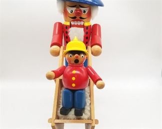 FATHER AND SON IN WHEELBARROW