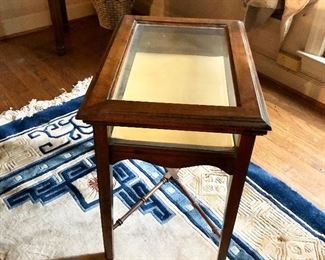 $100 - Glass display table - 21" W, 15" D, 21" H. 