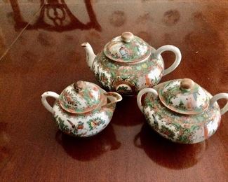 $120 - Famille Rose medallion tea set.  Teapot 8" W, 6" diam, 5.5" H; covered sugar bowl 6.5" W, 5" diam, 5" H;  covered creamer 5.75" W, 4.5" diam, 4.5" H. 
