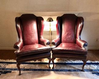 $400 Pair burgundy, hobnailed arm chairs - Each 33" W, 25" D, 50" H. (ONE CHAIR AS IS DUE TO MINOR WEAR ON ONE PART OF SEAT)