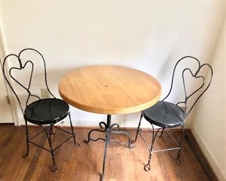$195 - Ice cream parlor table with two chairs.  Table 30" diam, 30" H;  chairs' seat 14" diam, 37" H. (CHAIRS NEED PAINT TOUCH UP)