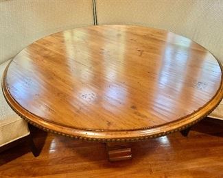 $595 - Bausman & Company pedestal, pine table with large nailhead detail on edge of table - 59" diam, 30.5" H. 