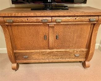 $595 - Vintage oak cabinet with 3 drawers and 2 cabinets, on casters -   54" W, 21" D, 39" H. 