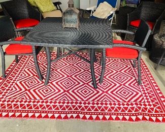 Outdoor reddish orange and white patio rug (SOLD) 63" x 91" $25. Like-new condition. 11 pc. outdoor vinyl wicker black patio furniture $250. Excellent condition. 