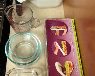 Collanders $1 ea. Glass measuring cup $2. Pyrex bowls and bread pan $1 each. Onion chopper $6