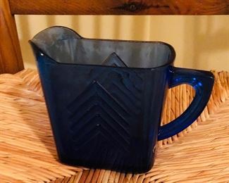 4" high blue glass pitcher $10