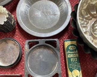 Several Tin Pie Pans with Advertising Names