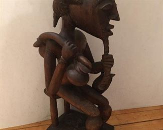 Side view of vintage Ivory Coast sculpture 16H"