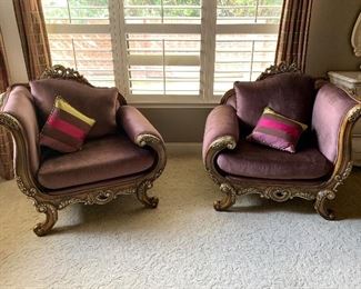 Ornate curved purple velour chairs